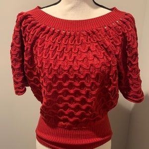 Red detailed boat neck sweater with large 3/4 sleeves. Size S/M